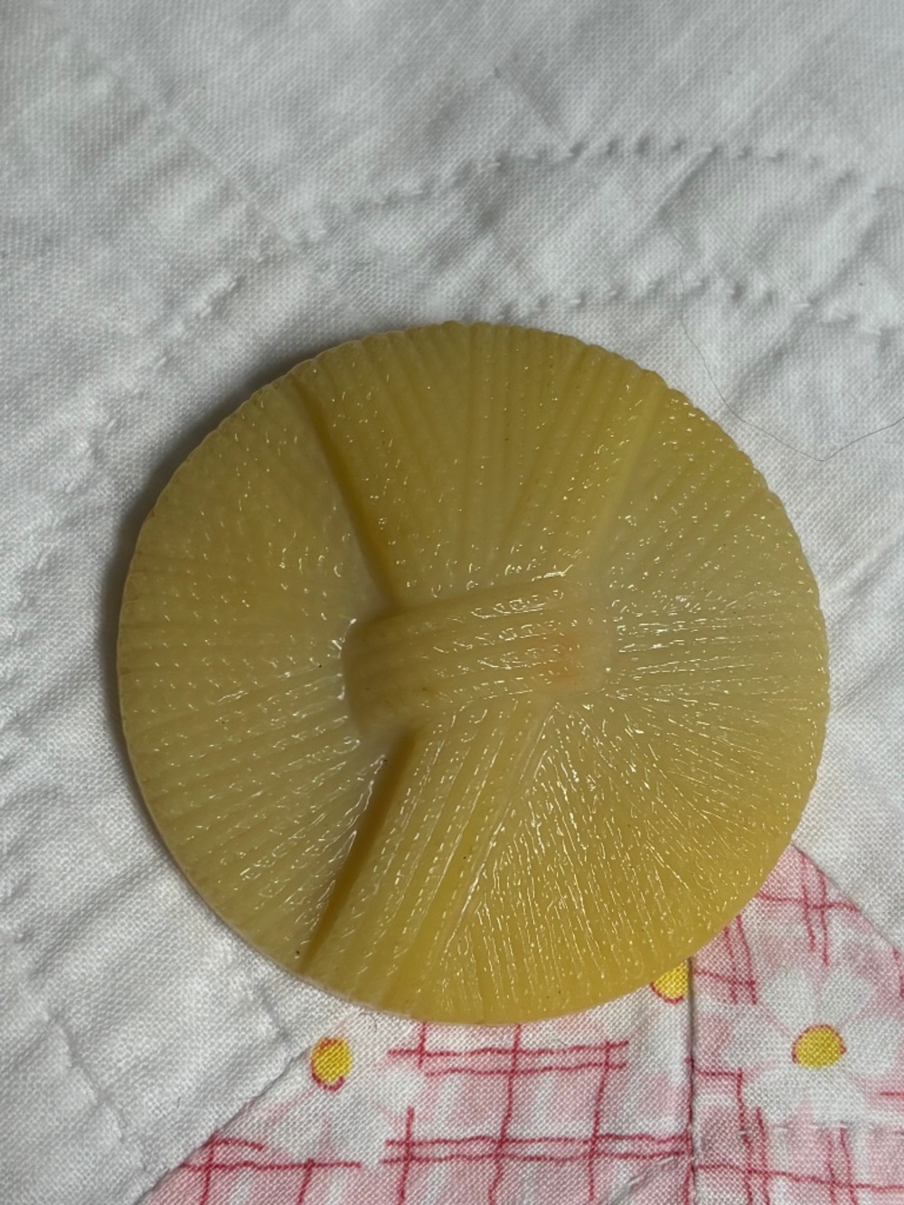 Large Vintage cream/yellow plastic or celluloid button ribbon motif